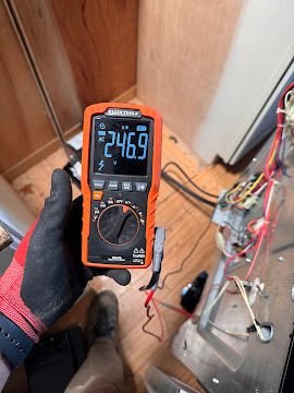 Digital multimeter reading 246.9 volts during an appliance supply test